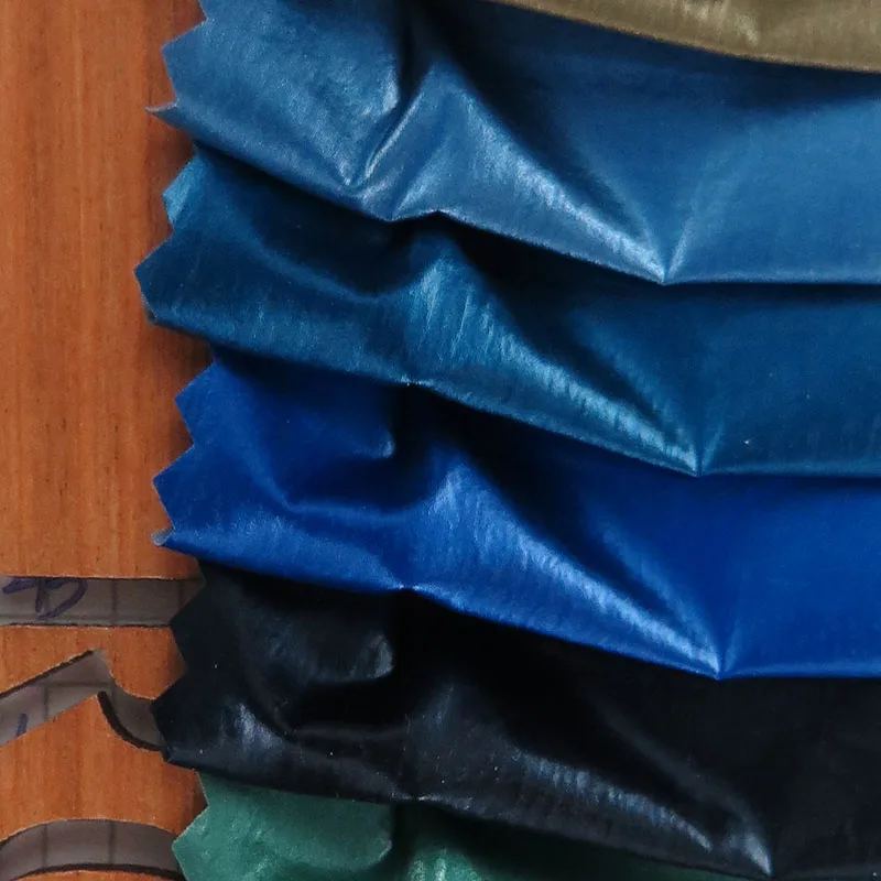 wholesale woven plain style Metallic shiny skin feel anti-static waterproof nylon fabric for coat down jacket, clothes
