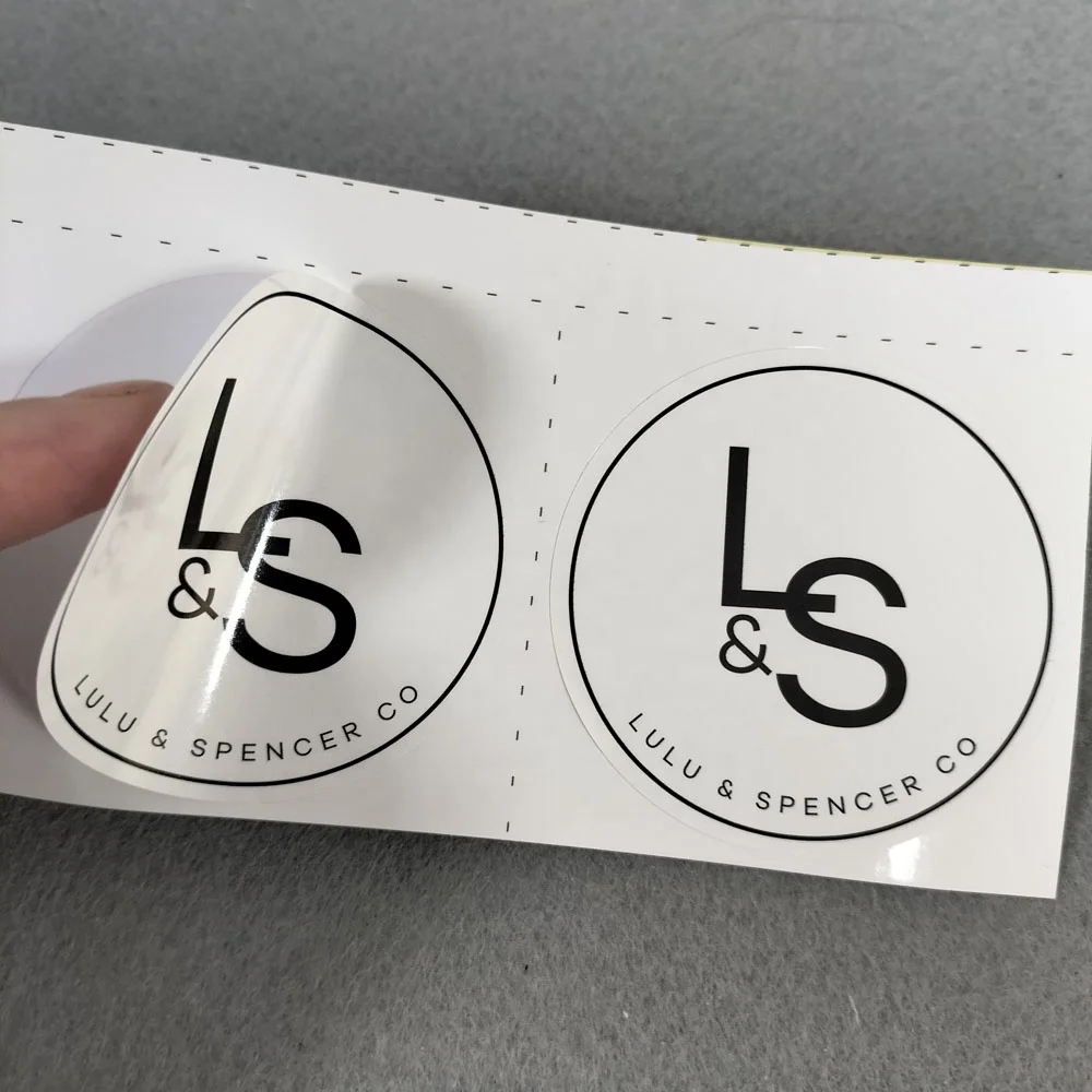 Wholesaler fashion design waterproof paper stickers garment label transparent stickers roll with your own logo