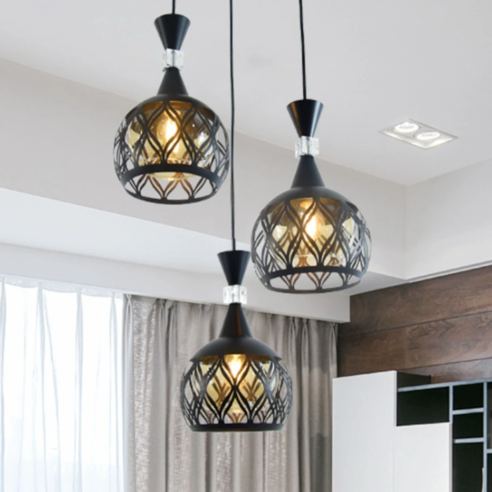 Creative vintage dining room chandelier Black hollow chandelier New three-head disc table iron lamp