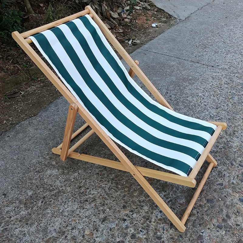 black and white stripe outside lazy rest beach hotel chaise lounge swimming pool wooden sun deck chair