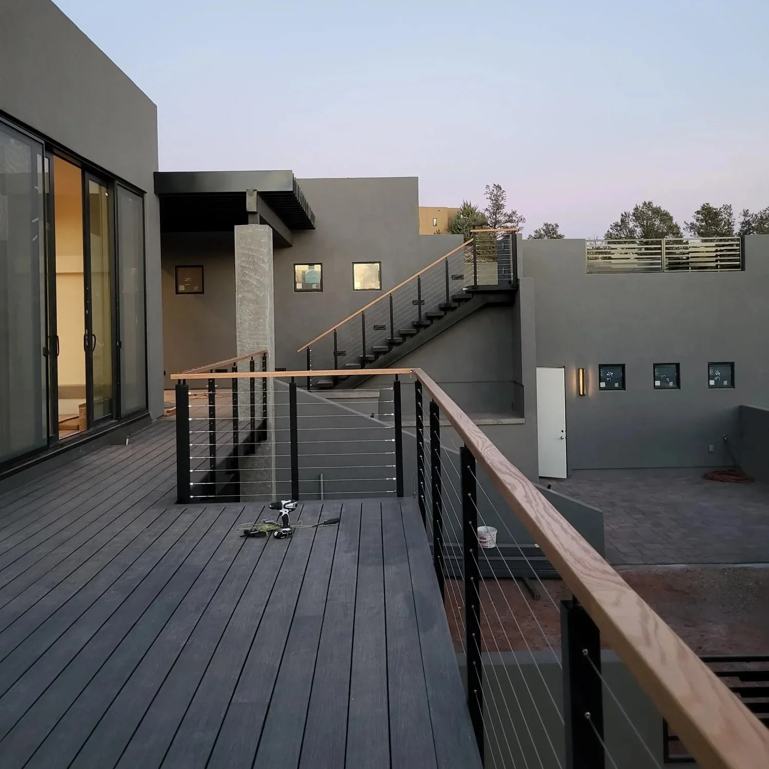 Black aluminum cable railing post with wooden handrail cable railing design