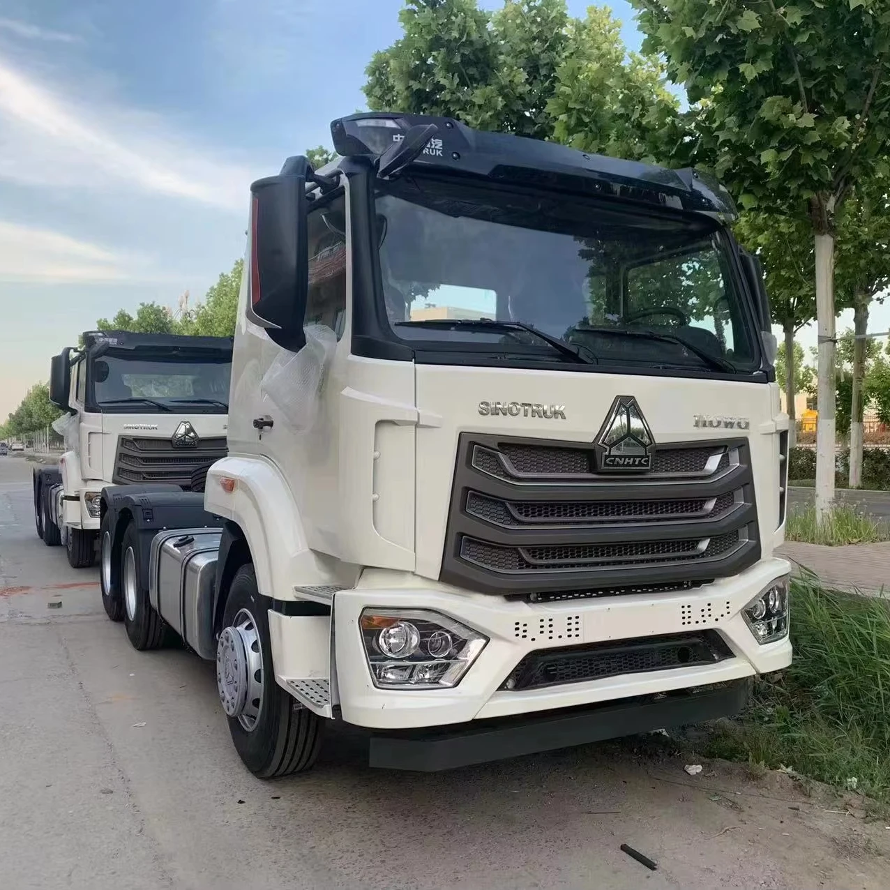 2023 китайский тягач Howo NX новая модель белый 6*4 по самой низкой цене для транспортировки.