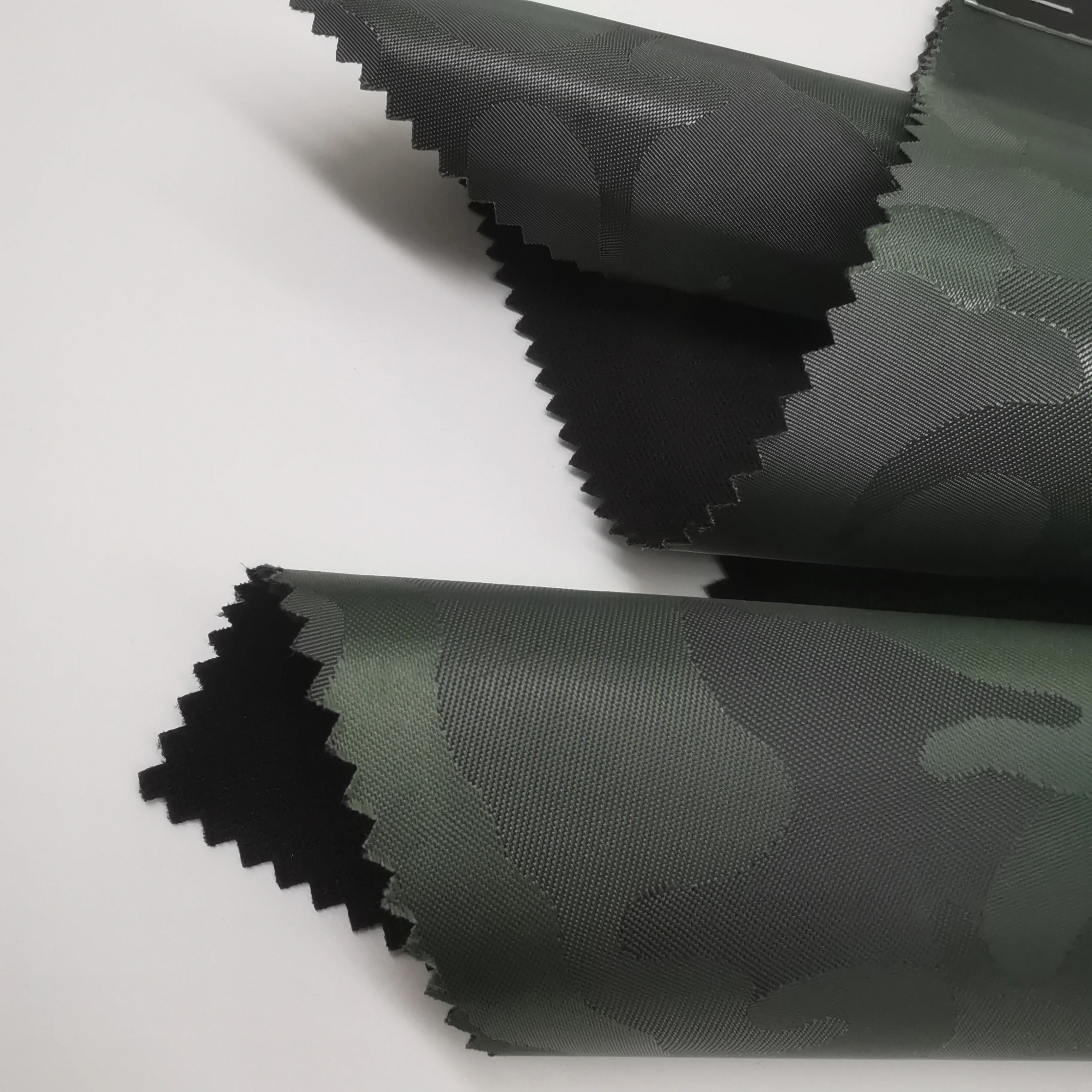 hot-selling camouflage jacquard Oxford fabric bonded knitted fabric with backpack