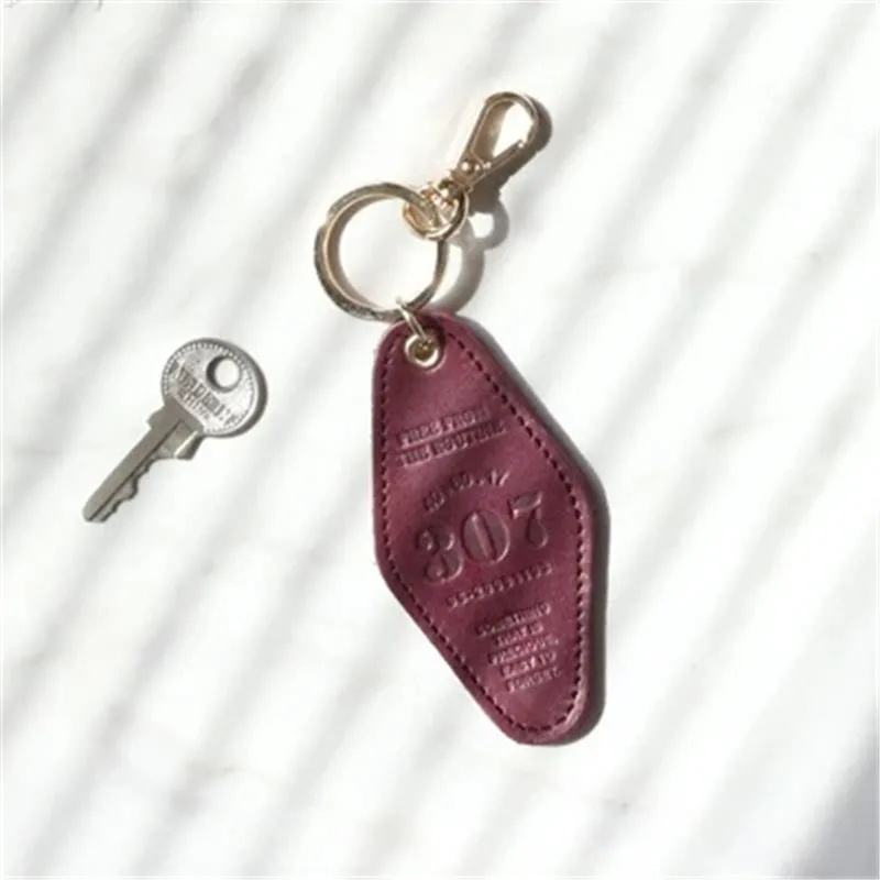 Wholesale Custom Embossed Logo Pure Color Hotel Keychain Blank PU Leather Hotel Room Keychain With Metal Hook Key Tags