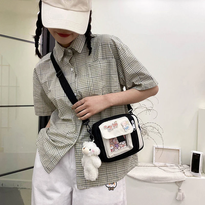 The new 2022 single shoulder slope across soft sister little girl cute nylon canvas bag bag change mobile phone lipstick female
