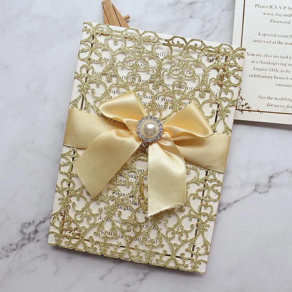 
Personalized Luxury Gold Glitter Lace Laser Cut Wedding Invitations with Jewel and Satin Bow 