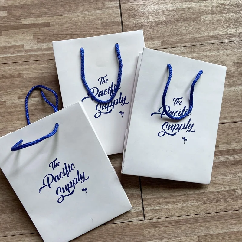 Wholesale Luxury Custom Kraft Paper Shopping Bag with White Handle Eco-Friendly for Gifts/Clothing Packaging Custom Logo Name