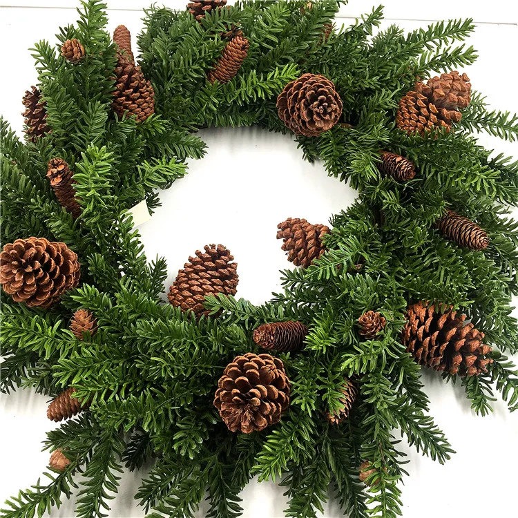 Artificial pine needles and pinecone rings wreath for Christmas