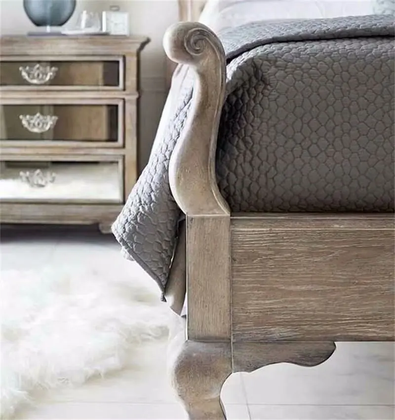 French bedroom with high - end stylish oak double bed