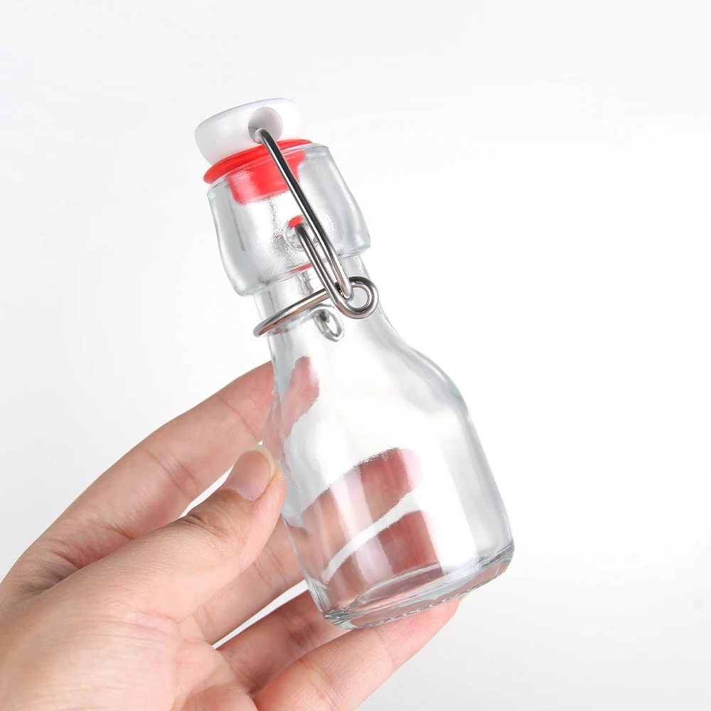 Wholesale popular UK 50ml Swing Top Drinking Water Empty Transparent Beverage Juice Coffee Milk Tea Glass Bottle In Stock