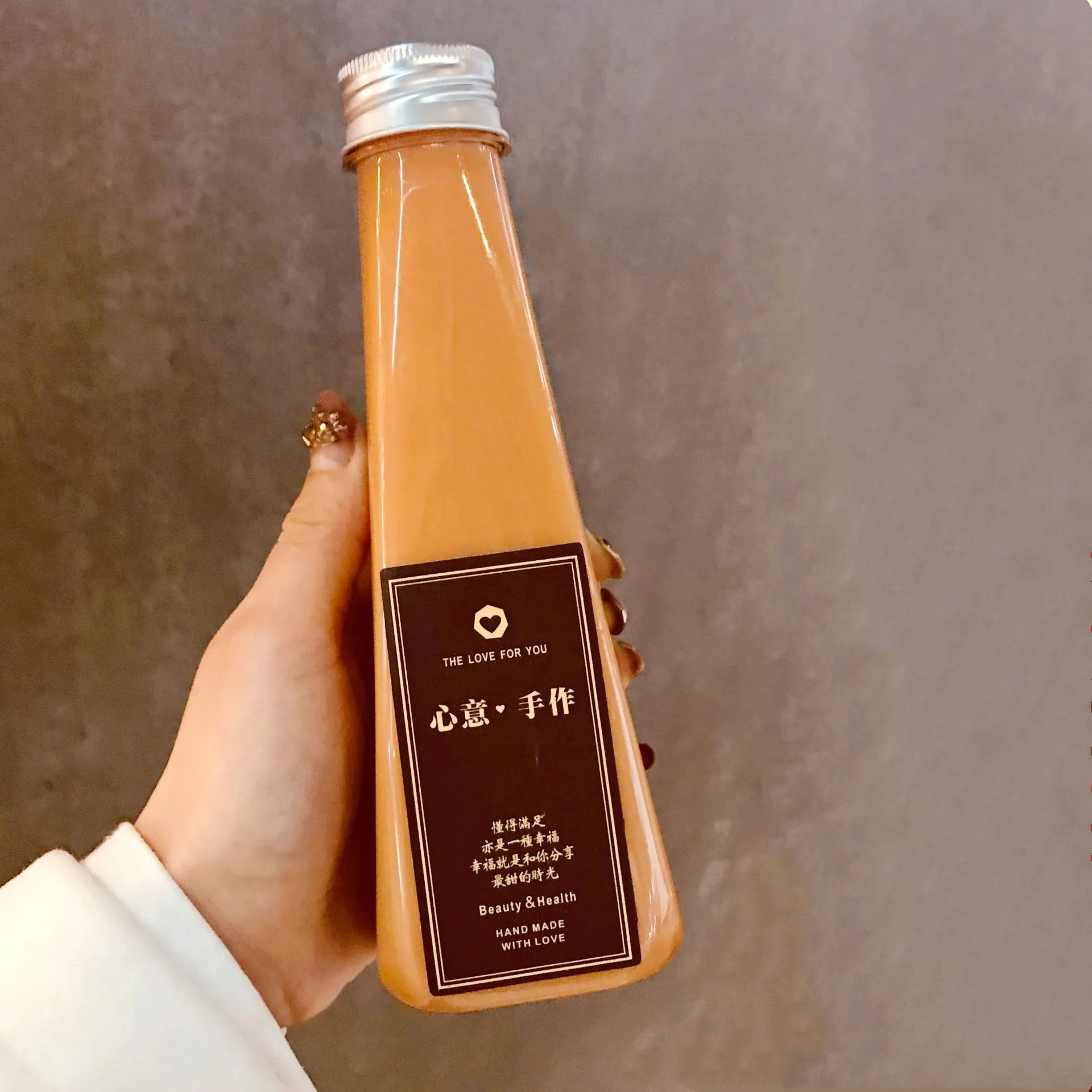 Cute 300ml 10oz tower-shaped thickened pet plastic bottle juice drink yogurt tea drink bottle conical beverage bottle