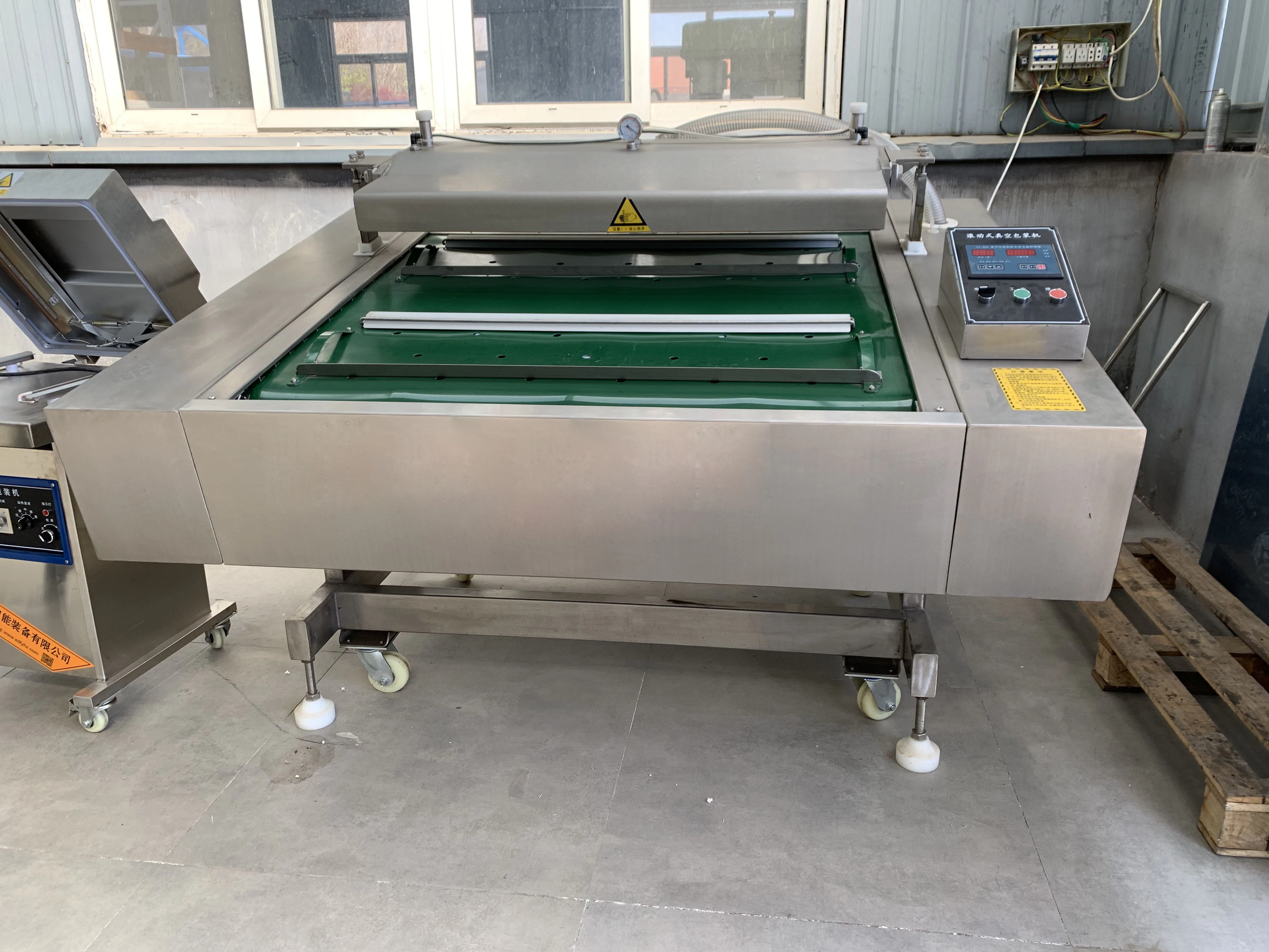 DZ-1000 automatic packing food rolling belt type rolling vacuum packaging machine