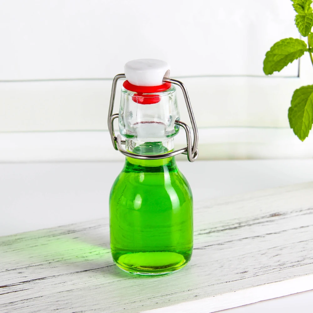 Wholesale popular UK 50ml Swing Top Drinking Water Empty Transparent Beverage Juice Coffee Milk Tea Glass Bottle In Stock