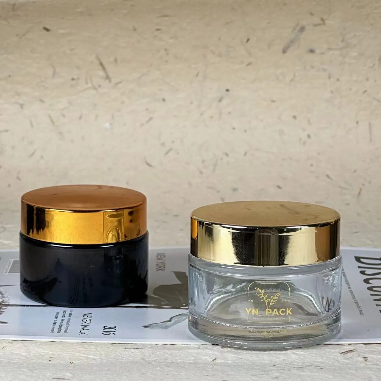 Wholesale Custom glass jars gold lids cosmetics skincare glass jar 2oz with lid