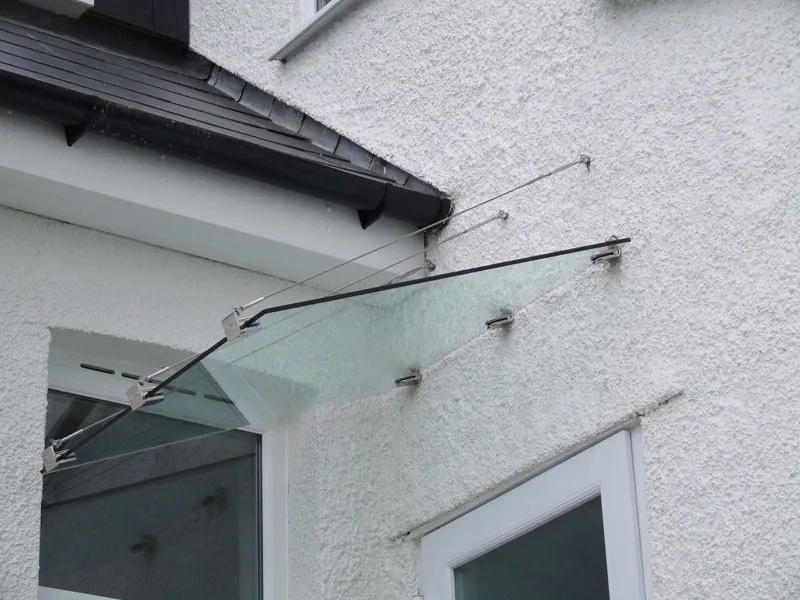 glass canopy with stainless steel support