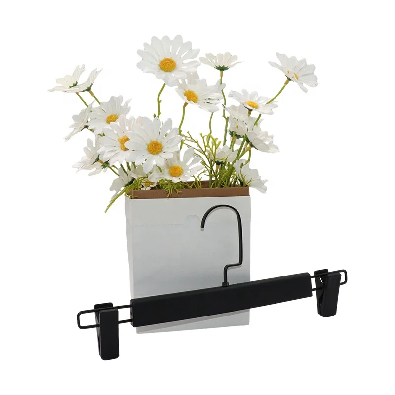 Fashionable plastic hangers available for clothing stores can also be used for headbands and bags