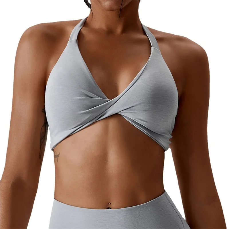 OEM Sportswear Custom Logo New Arrival Women Padded Nude Yoga Hanging Neck Twisted  Bra Fitness Sexy Blank Sports Bra For Women
