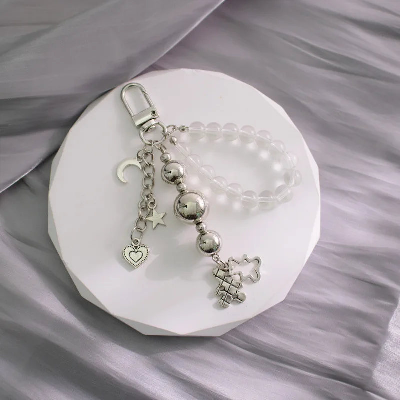 ins Sweet cool wind beaded Stars Moon bag key chain Metal black and white silver bear love cross car key chain pendant wholesale