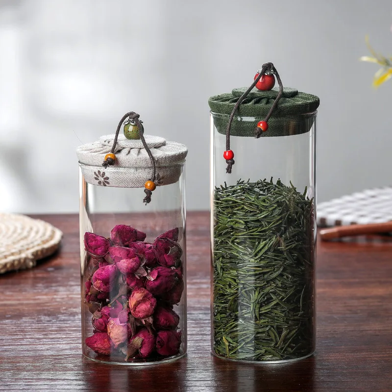 High quality fast delivery heat-resistant glass tea cabs candy storage jar food grade container borosilicate jars cloth cover