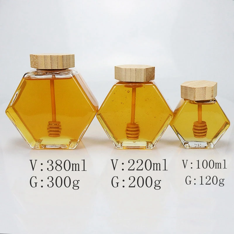 Wholesale 100ml 220ml 380ml Unique Hexagonal Glass Bottle Jar  For Honey with Wooden Lids and Dipper