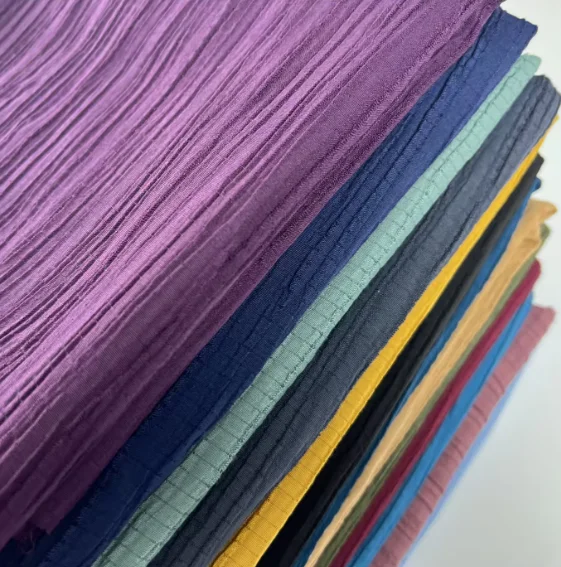 Woven TR Crinkled Fabric Korean Wavy Stretch Crepe Fabrics Soft Polyester Rayon Pleated Dyed Floral Crepe Fabric for Dress