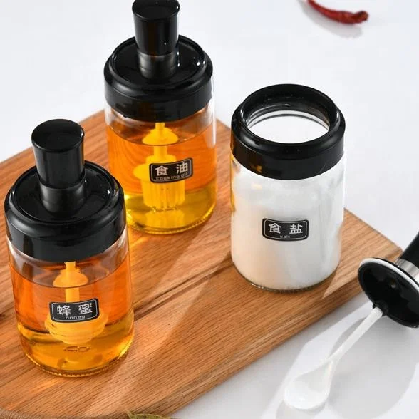 8 OZ Transparent glass seasoning jar with integrated spoon and lid for household use