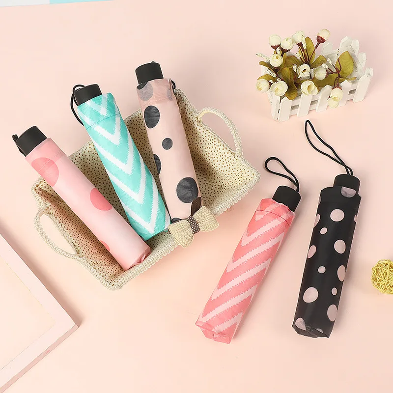 
Korean version of Small Qingxin super mini folding umbrella men and Women Sun Umbrella Large Forest Department three-fold trade 