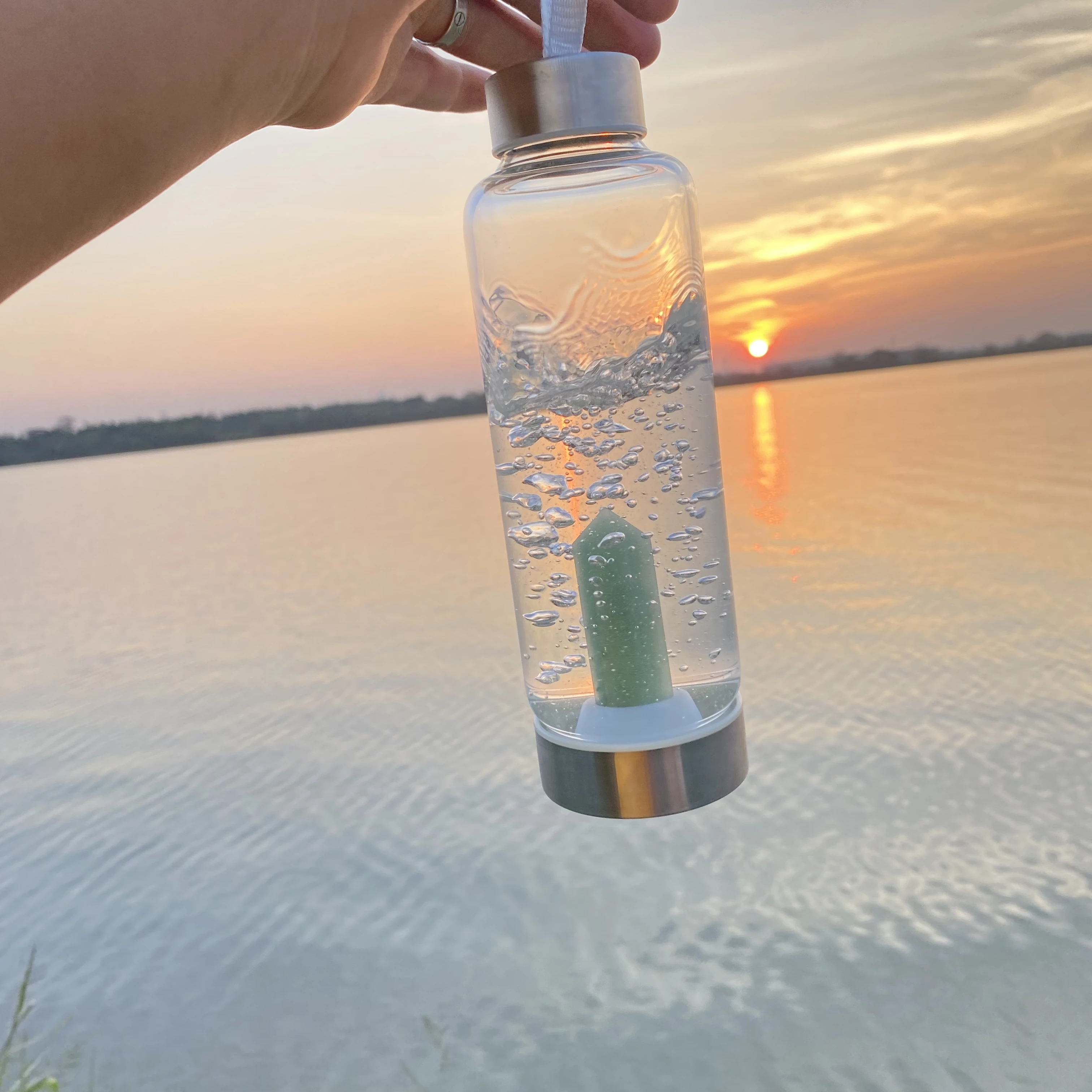 Glass Water Bottle With Rose Quartz Crystal on the Bottom