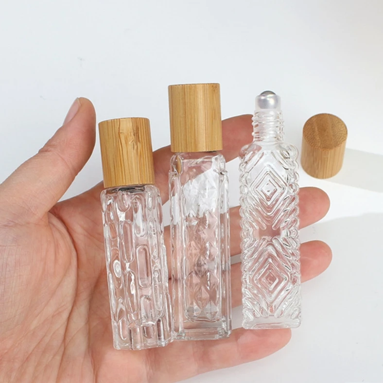 Custom logo 10ml 12ml Empty Refillable Perfume Glass Roll On Roller Bottle Essential Oil Vials With Bamboo Wooden Cap Metal Ball