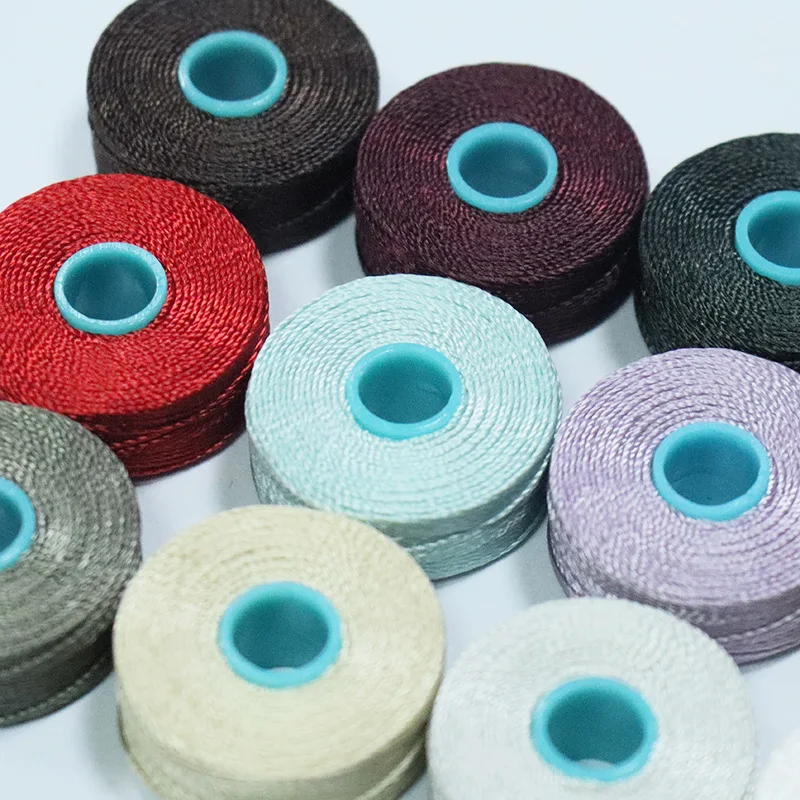 Заводские цены цвета 30 #210D/3 Tex70 высокая прочность L-стиль 100% нейлоновые предварительно намотанные бобины швейные нитки с меньшими боками