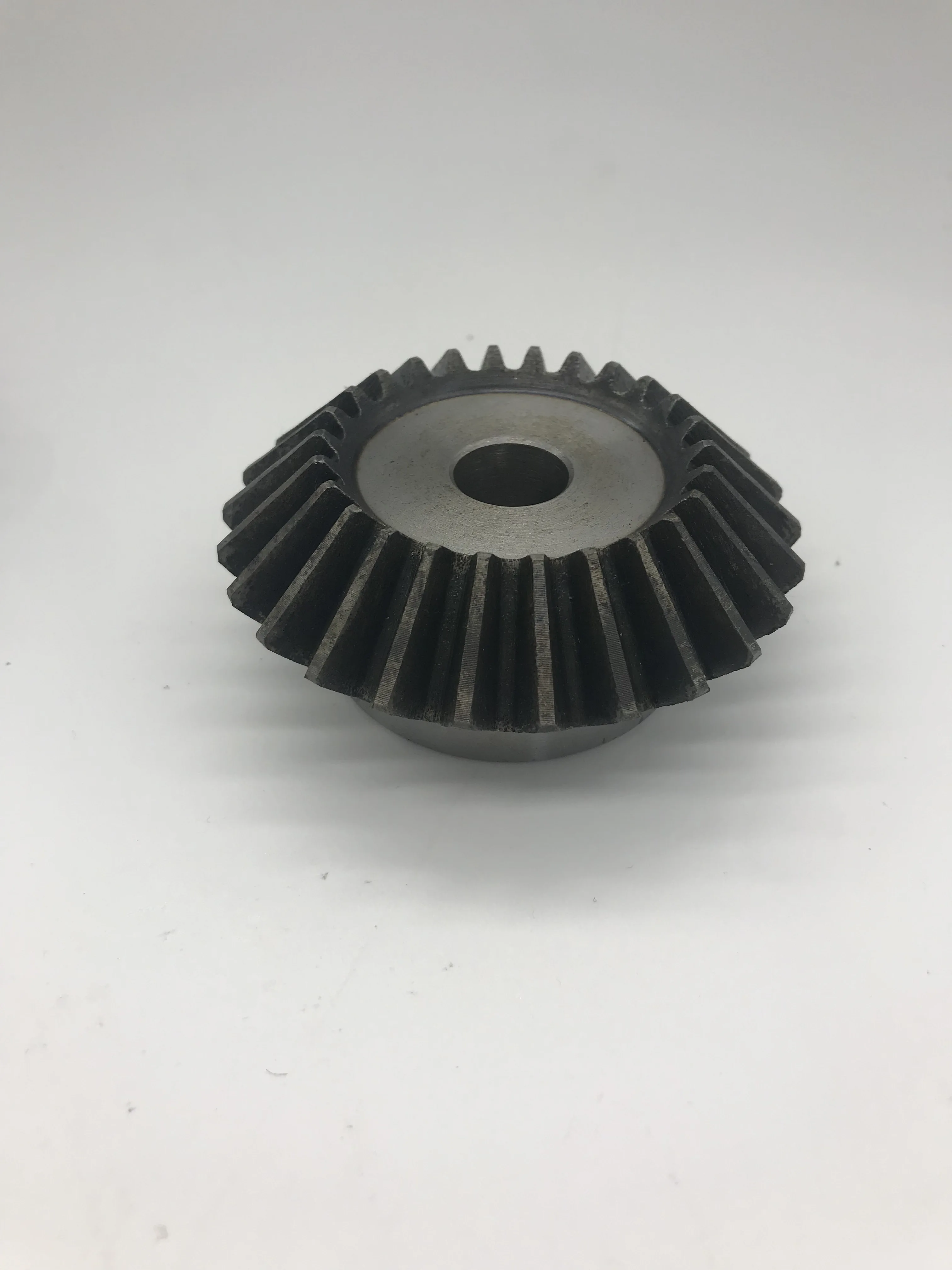 
High strength and low cost bevel spur gear, forging process hardened teeth for baler 