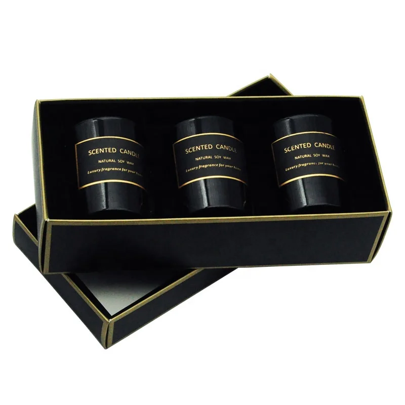 A three-piece black glass jar scented candle gift set