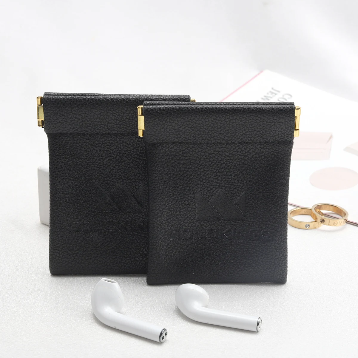 Custom Emboss Logo Reusable PU Leather Black Bag For Bluetooth Headset Packaging Shrapnel Openings Leather Dust Pouch