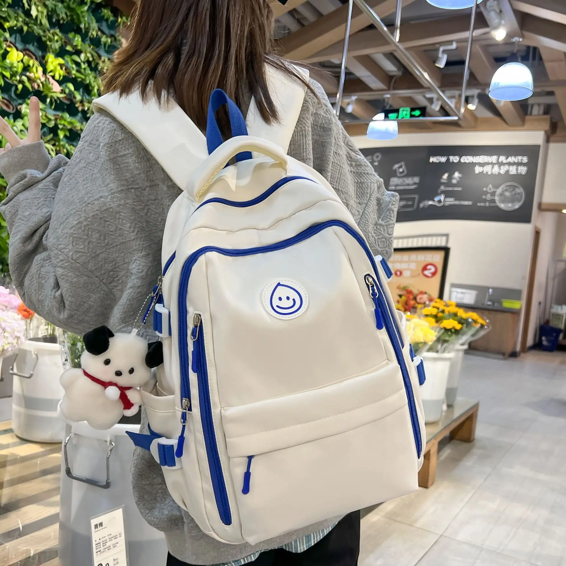 2023 Classic Design Custom LOGO Smiling Face Label Multi-pockets Middle School Students School Backpack