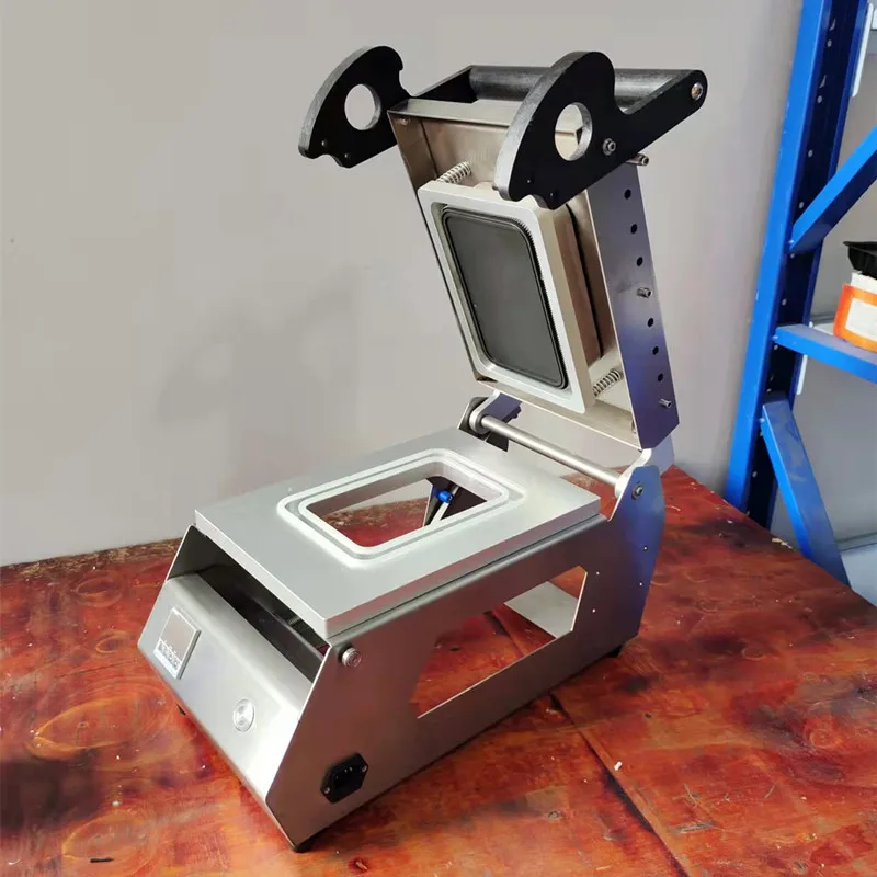 China Manual Fast Food Lunch Box/Tofu Tray Heat Sealer Packaging Machine
