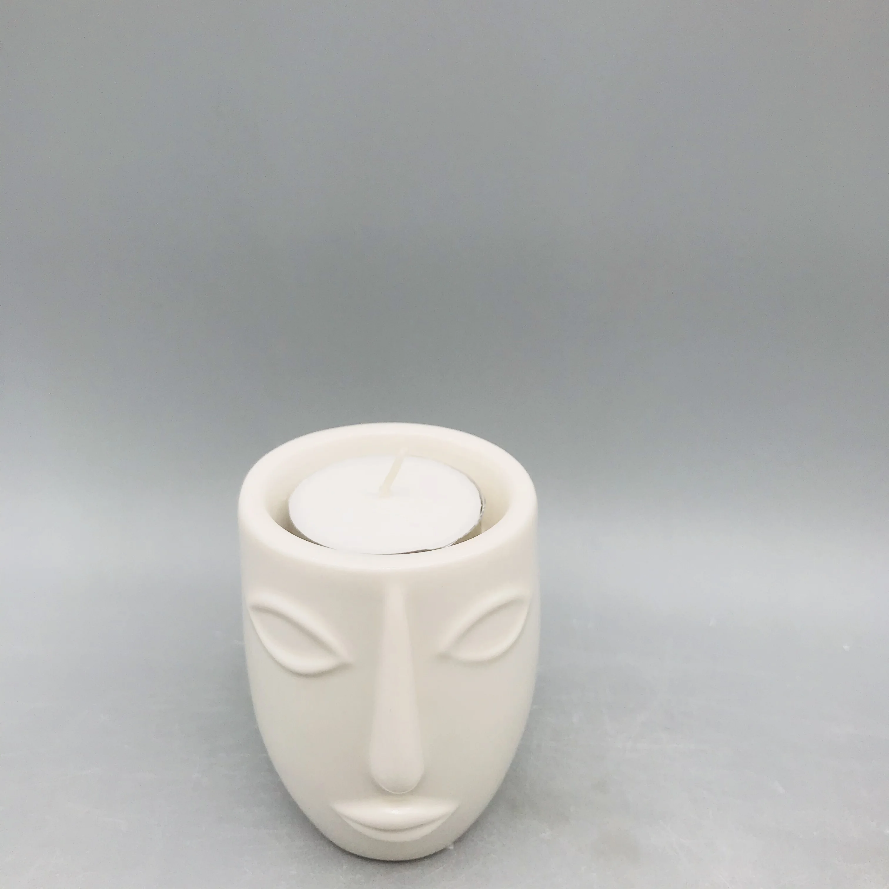 
Customized black and white ceramic human face candle holder 