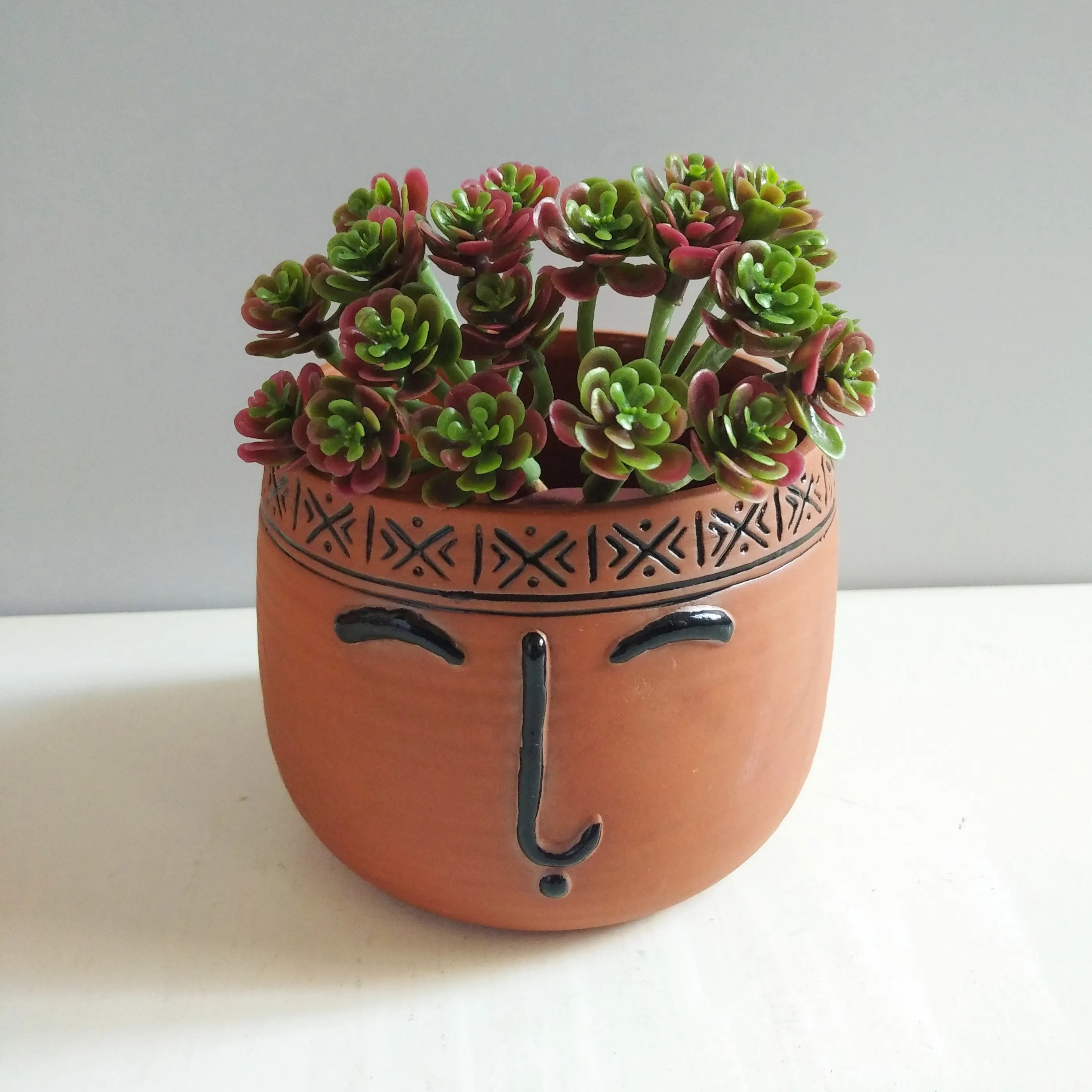 Cheap hand painted human face brown large unglazed terracotta flower pot for wholesale