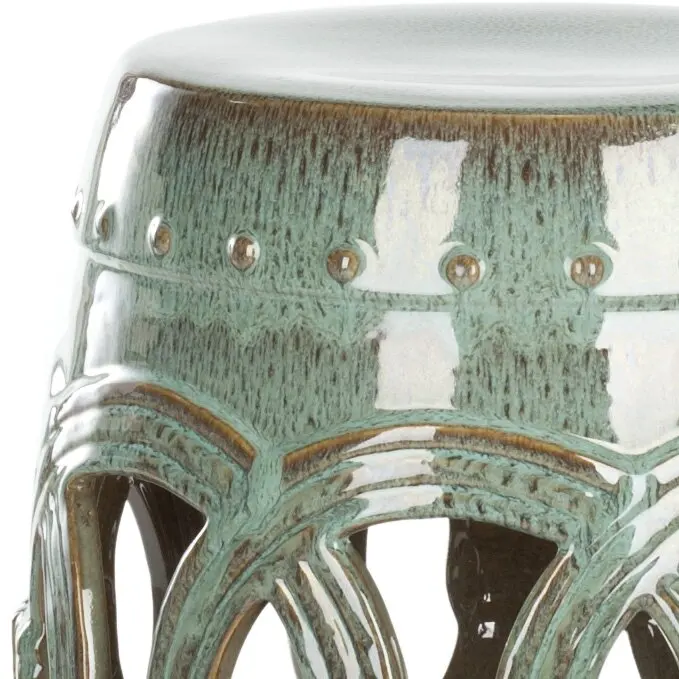 The modern Chinese side table is exquisitely made of green ceramics. The hollow shape can be placed in any space.