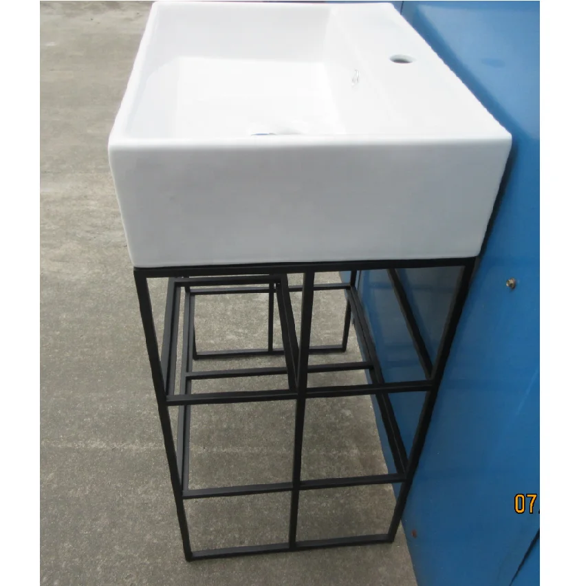 Steel and hampered copper apron bathroom vanity bases Carrara marble counter top  black round tubing washstand floating sink leg