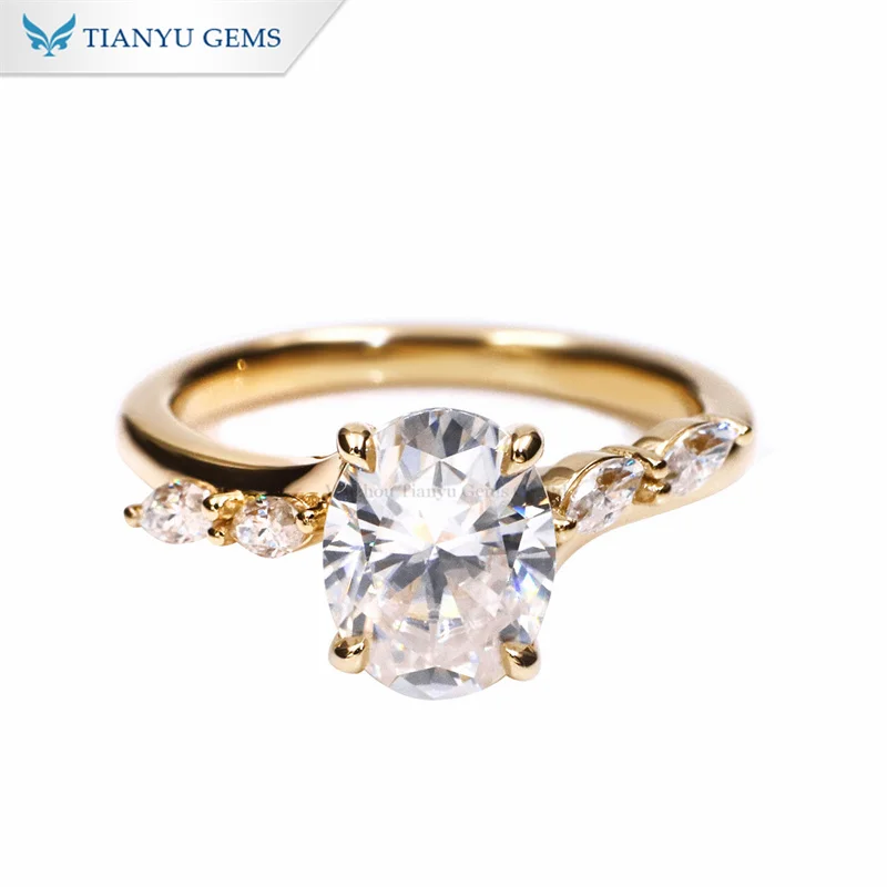 Tianyu gems yellow gold Oval centre diamond with Marquise cut stones on the shoulders engagement ring