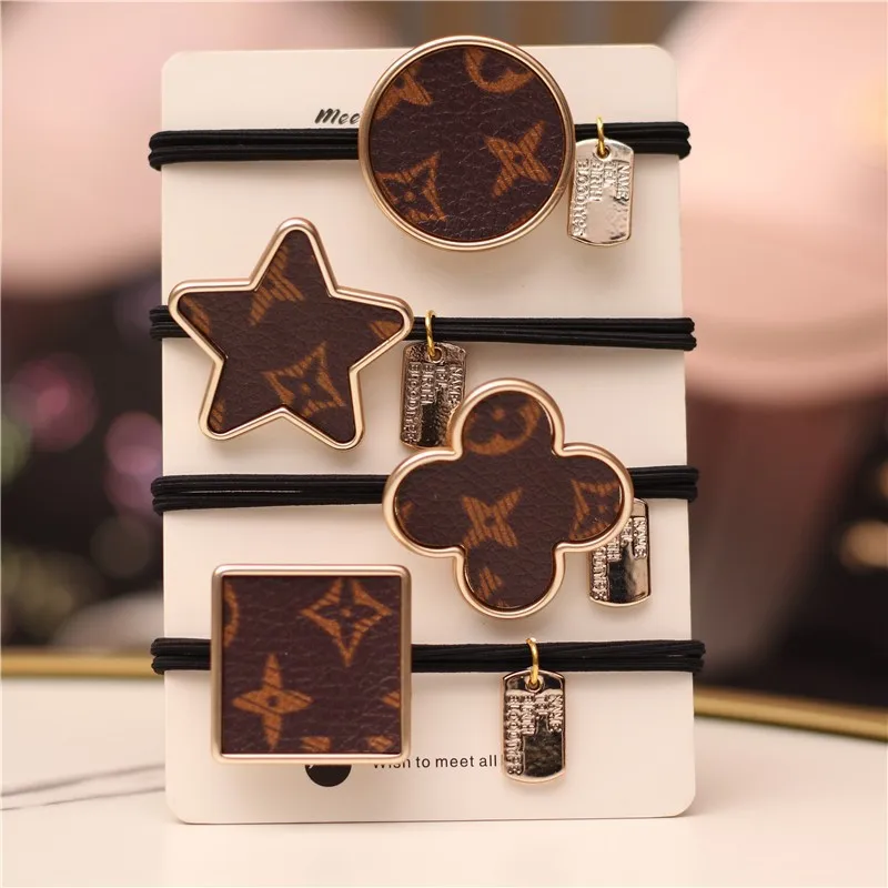 2022Classic hair rope big name leather printed hair ring four-leaf clover star retro style half ball head ponytail elastic rope