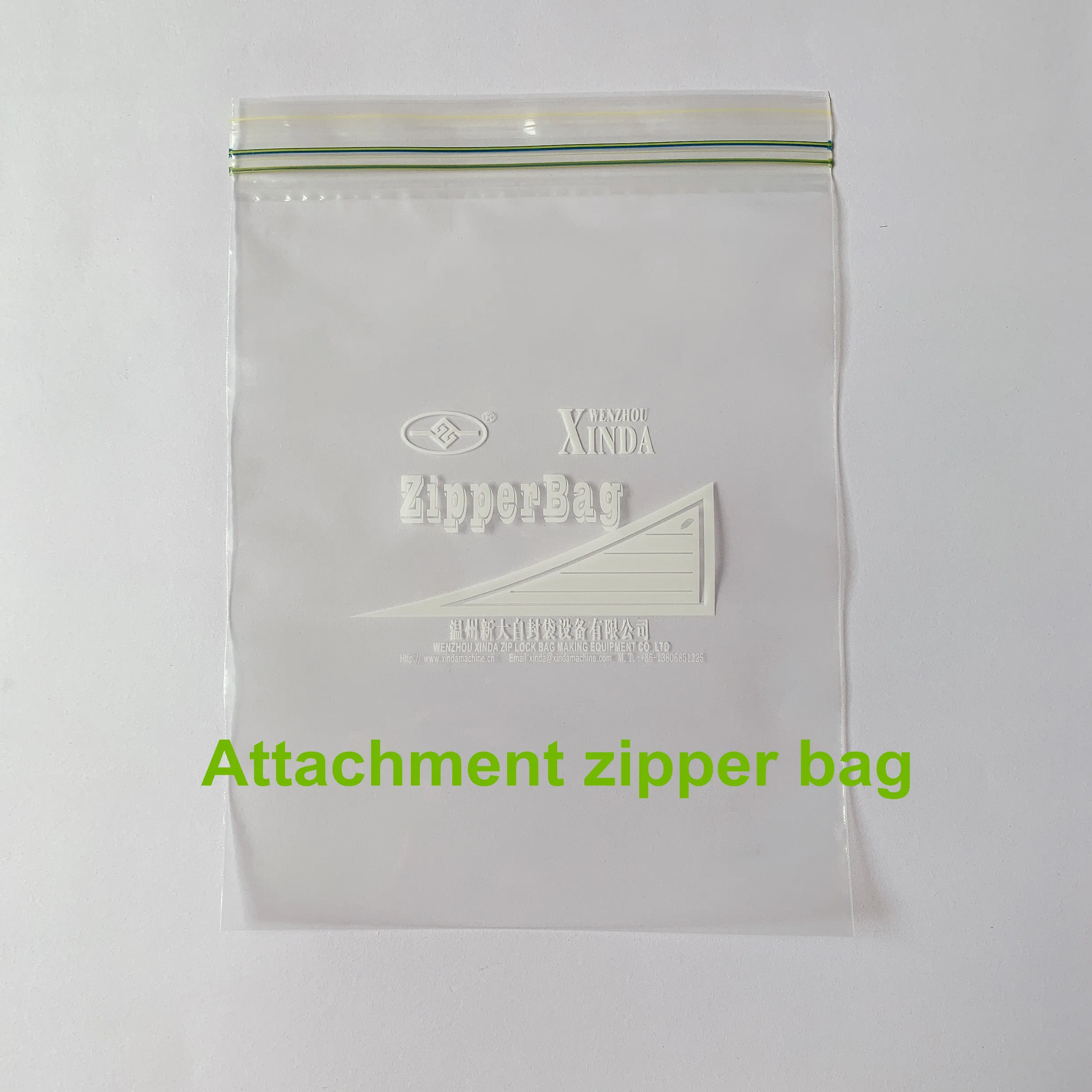 Zipper bag making machine with zipper attachment & auto hanger device cut on the rubber roller