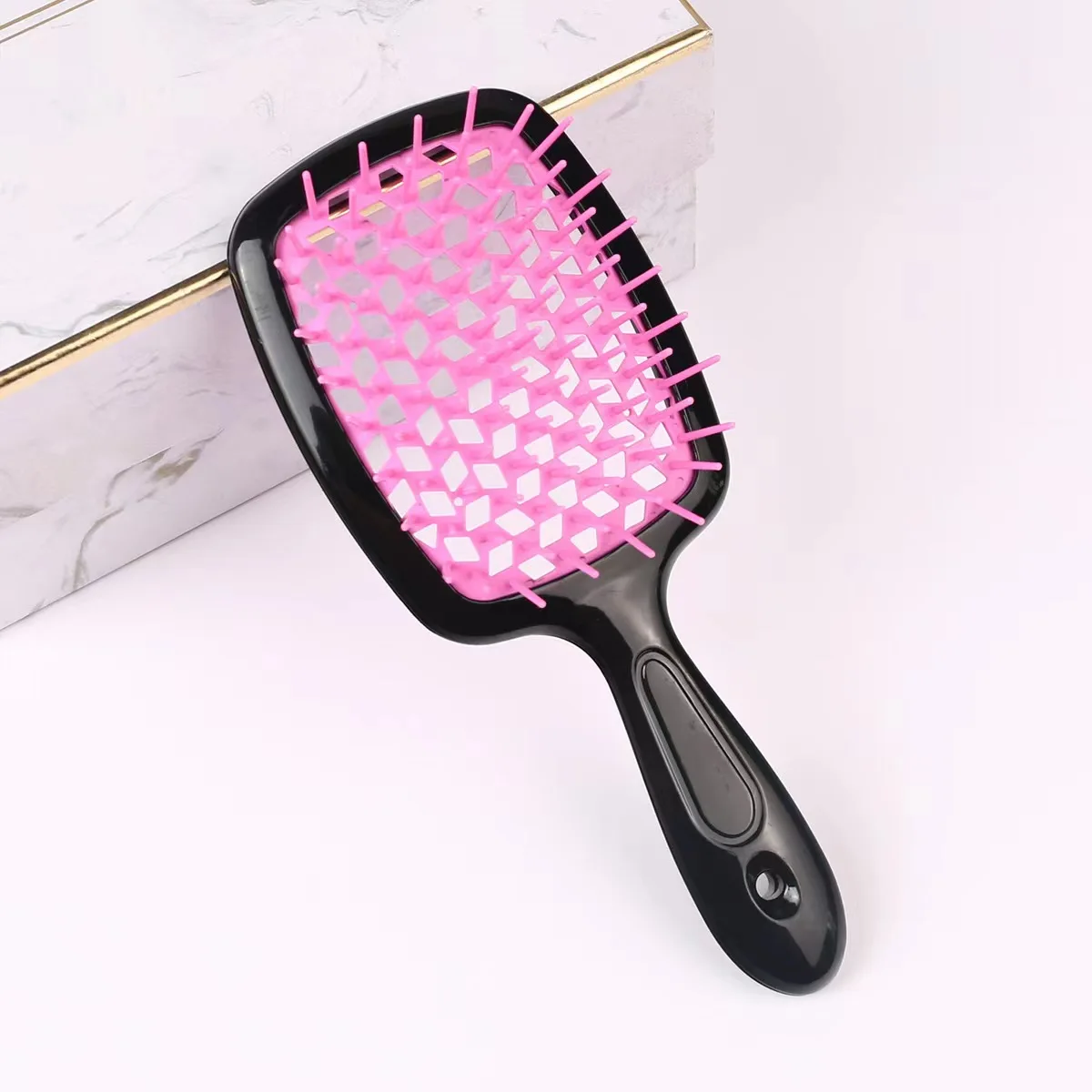 2024 New Trend Plastic Waterproof Wet Hole Mesh Detangling Comb With Good Product Quality