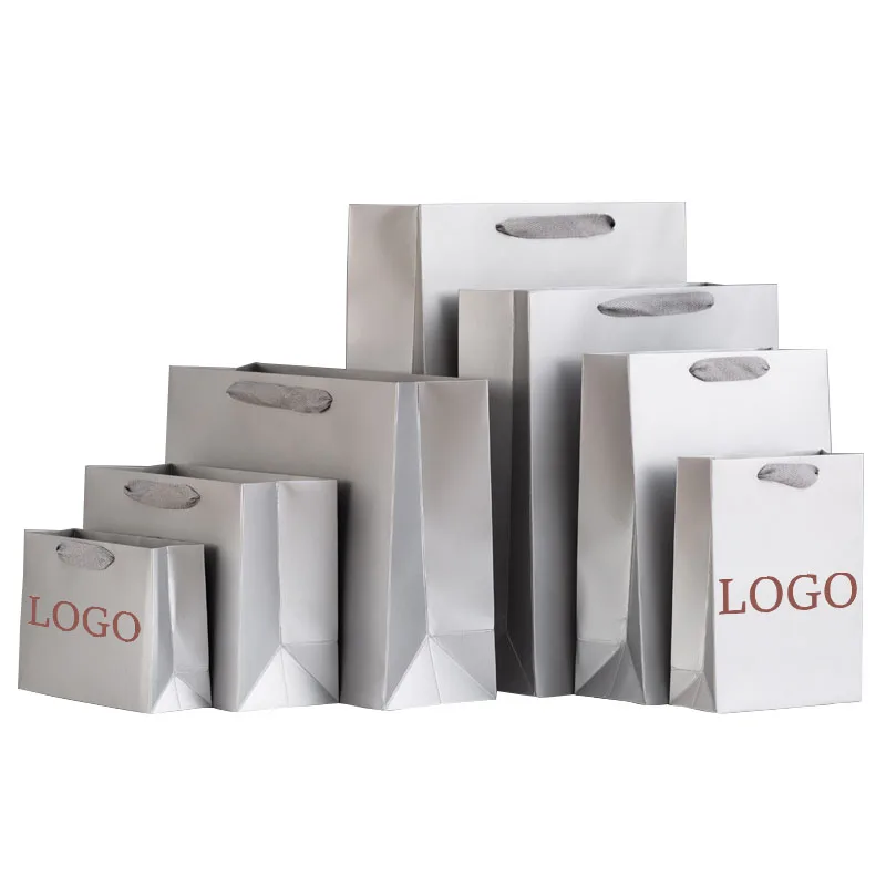 Popular flat handle thick bottom plate ivory board matt laminate waterproof silver packaging paper bag with your own logo