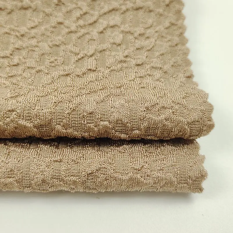 Chinese cheap Fashion polyester spandex knitted new foaming process jacquard fabric for tops dresses pants