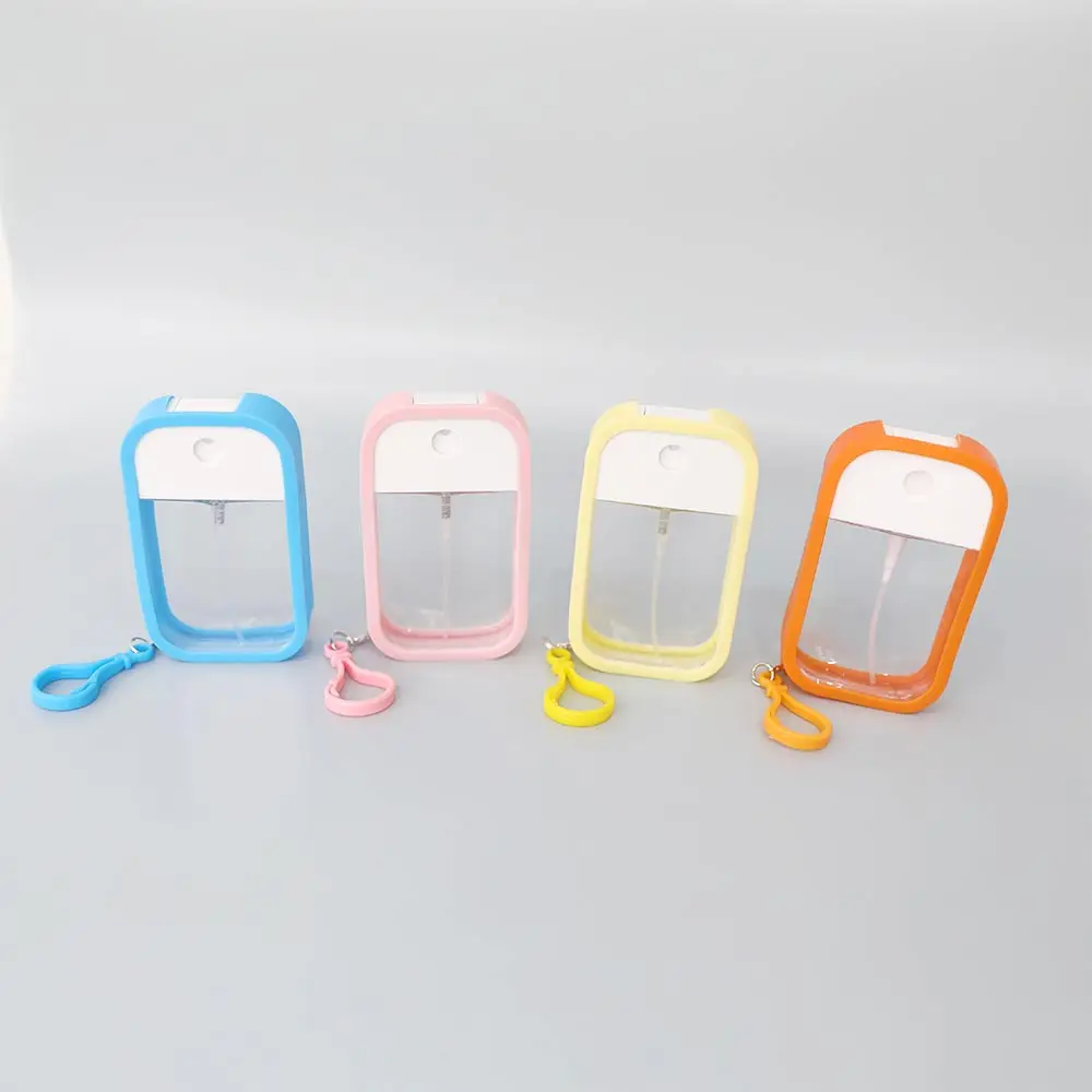 Custom Portable Travel 50ml Refillable Empty Plastic Spray Bottles Card Perfume Atomizer with Silicone Case Keyring