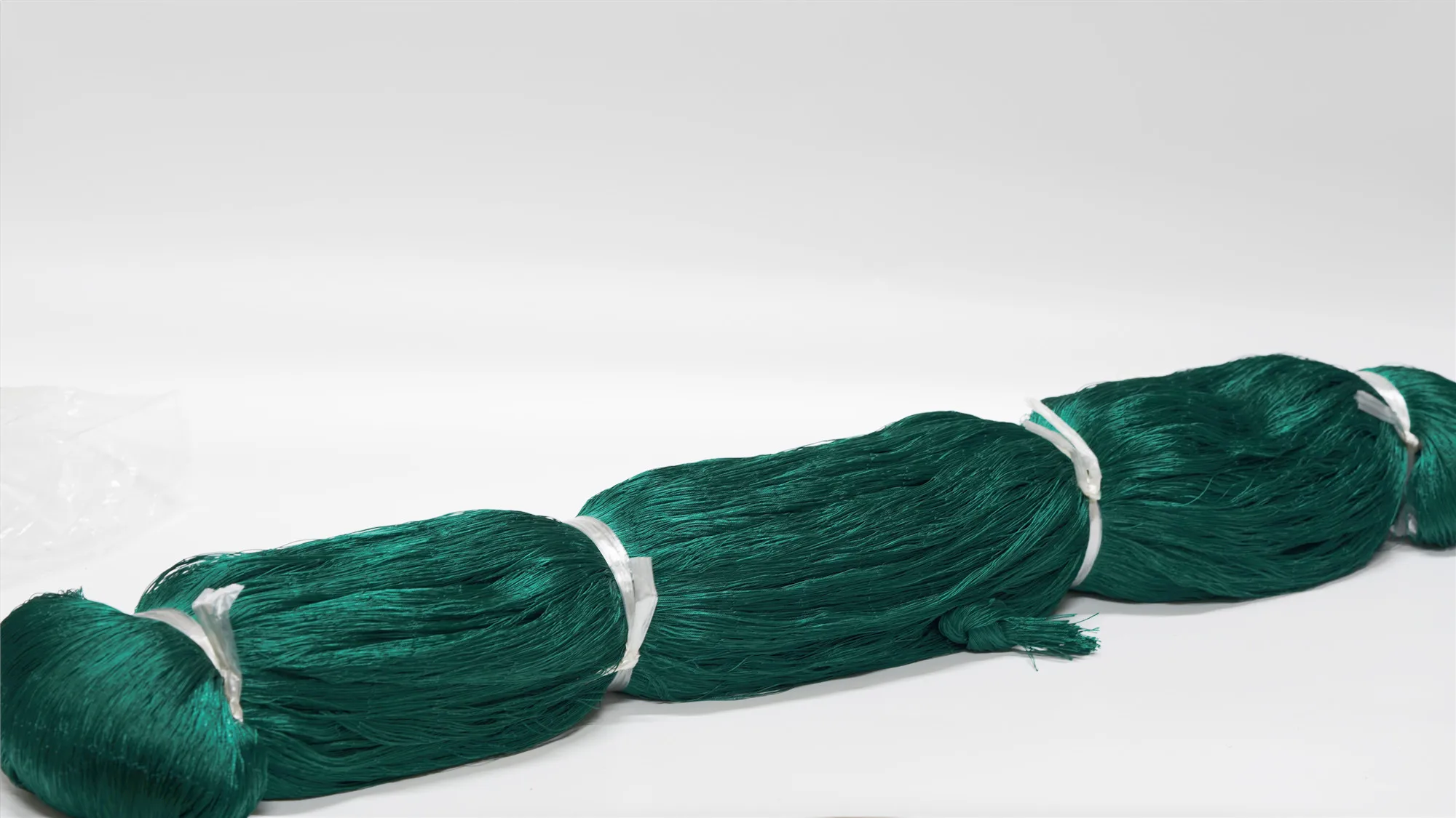 wholesale nylon/polyester fish net 210D multifilament knotted fish farming net fishing net factory