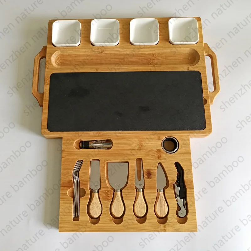 Charcuterie wooden bamboo cheese board set with cutlery