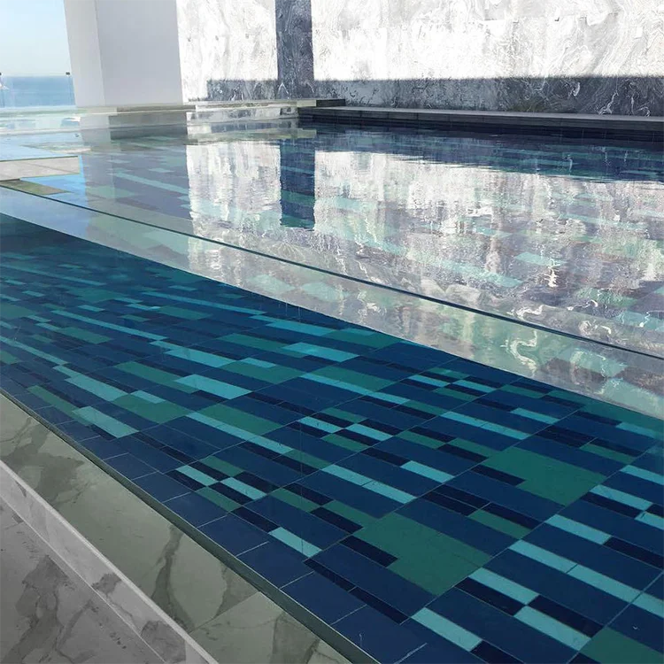 What material of glass is used in acrylic glass swimming pools