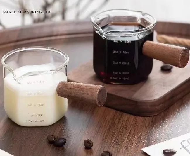 Small milk cups with wooden handles